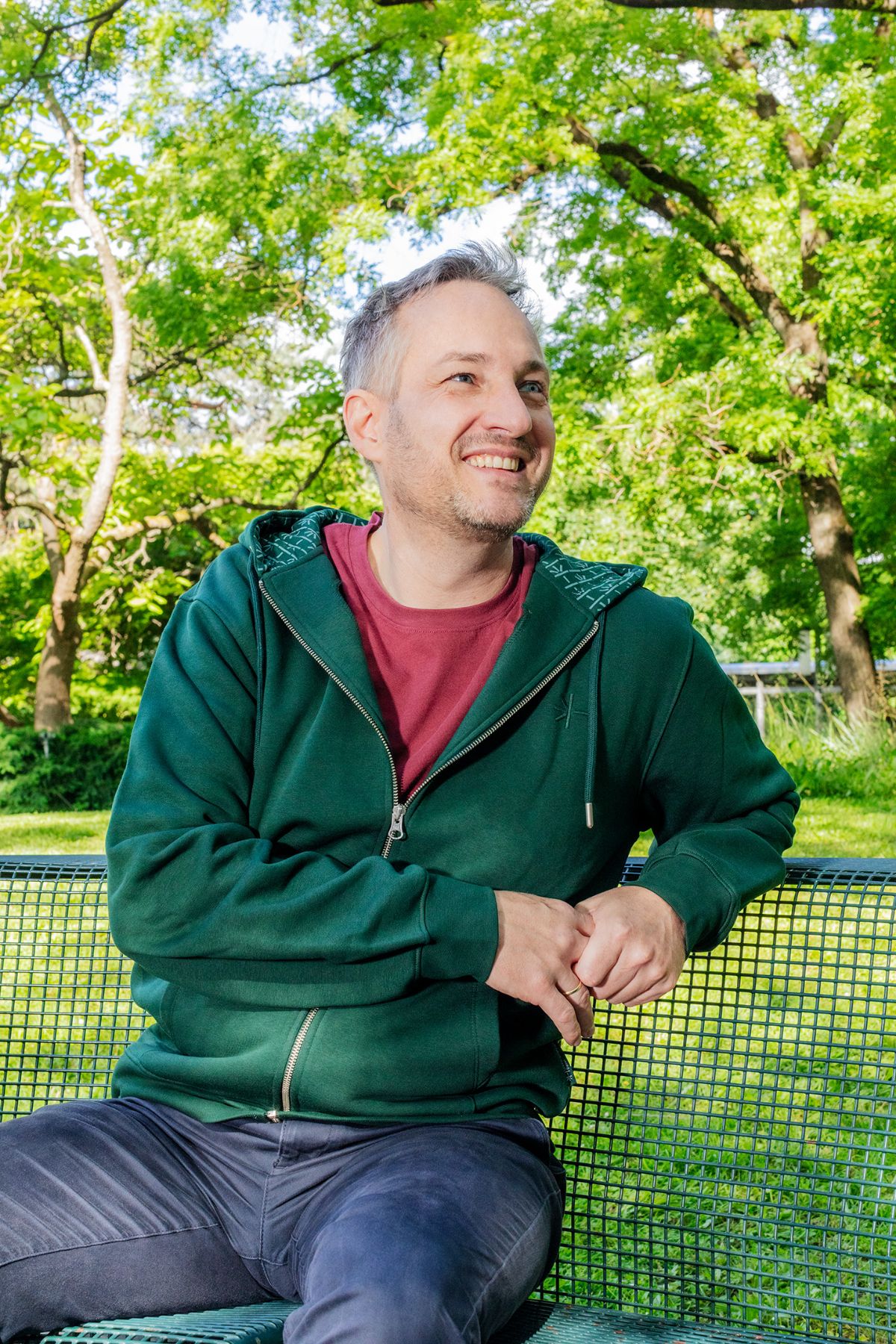 Employees with dark green USB merchandise hoodie
