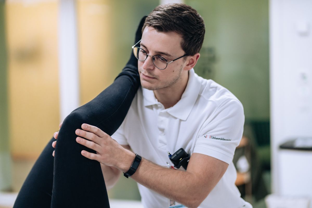 Physiotherapist treats a patient
